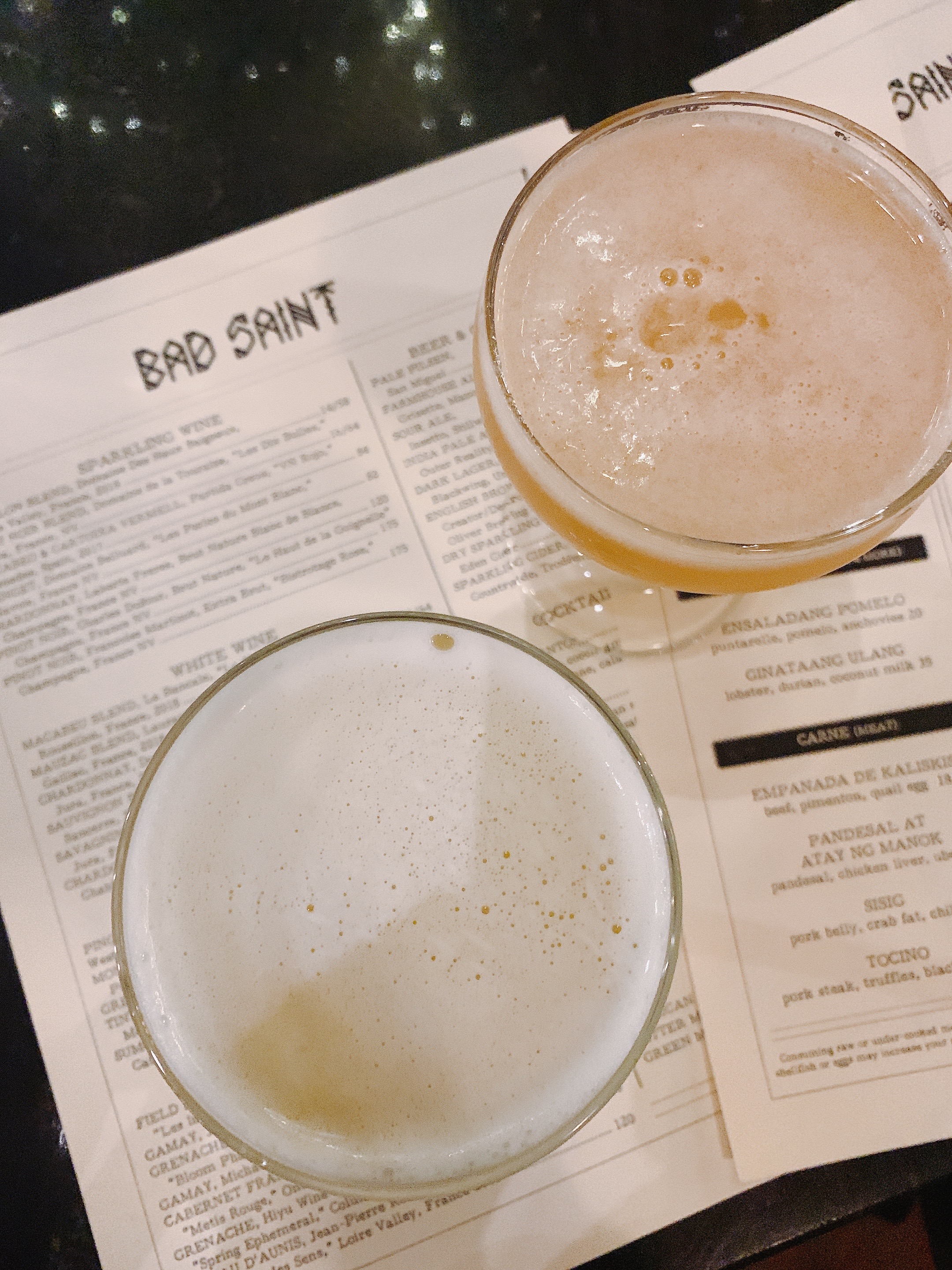 view of bar seating and drinks at the bar